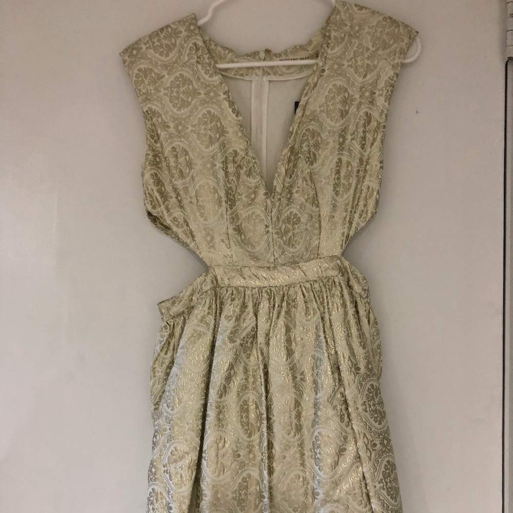 Gold dress with cutout sides